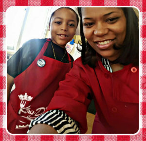 A photo of dia with her son cooking for cooking with kids column in successful black parenting magazine.