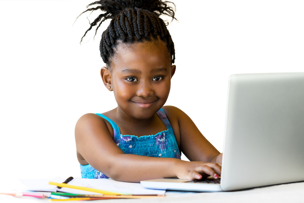 Girl on computer on successful black parenting magazine