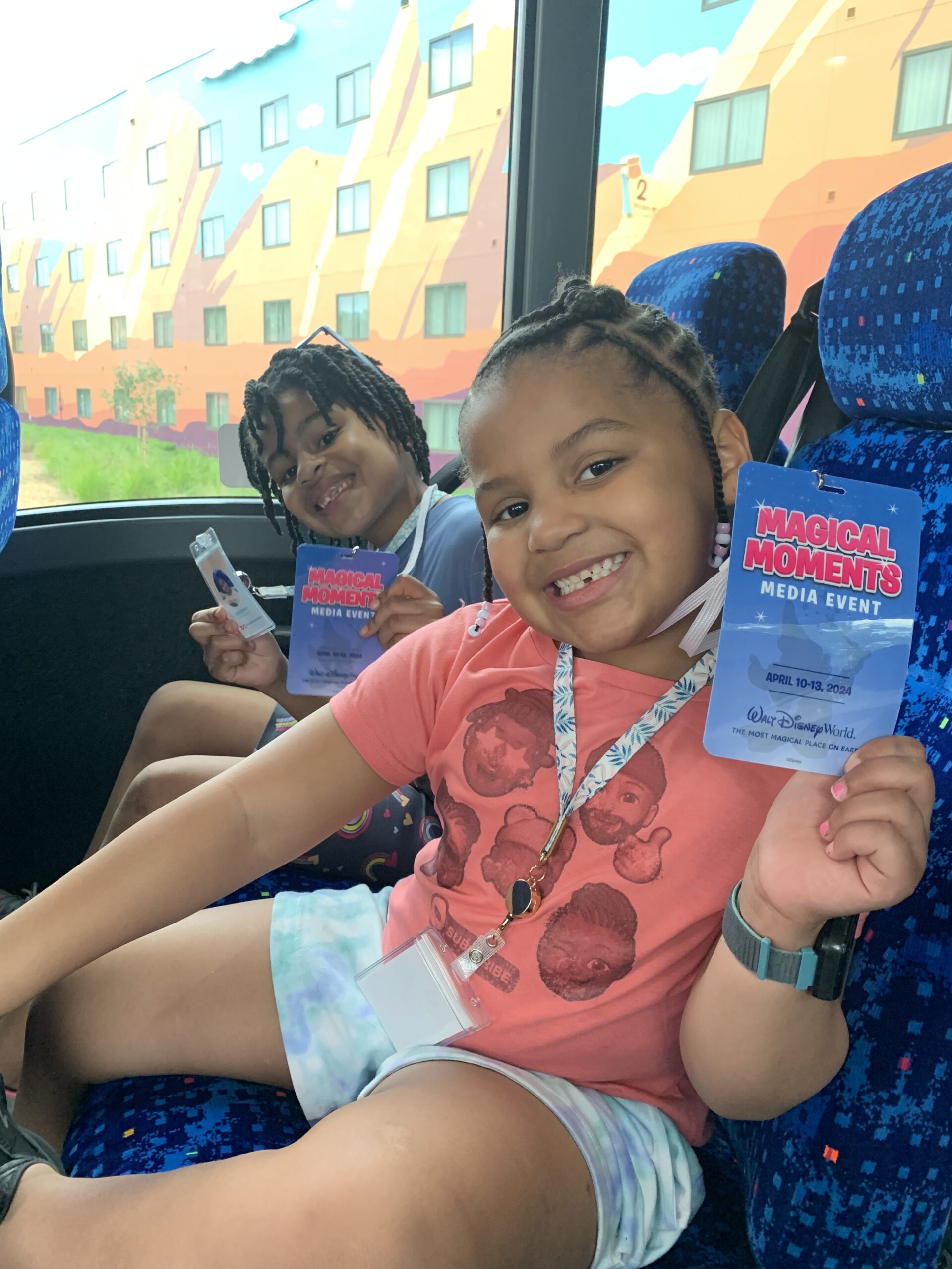 L to r: menzi and myla show off their media credentials and auntie-created press badge during the kids' content creation trip..