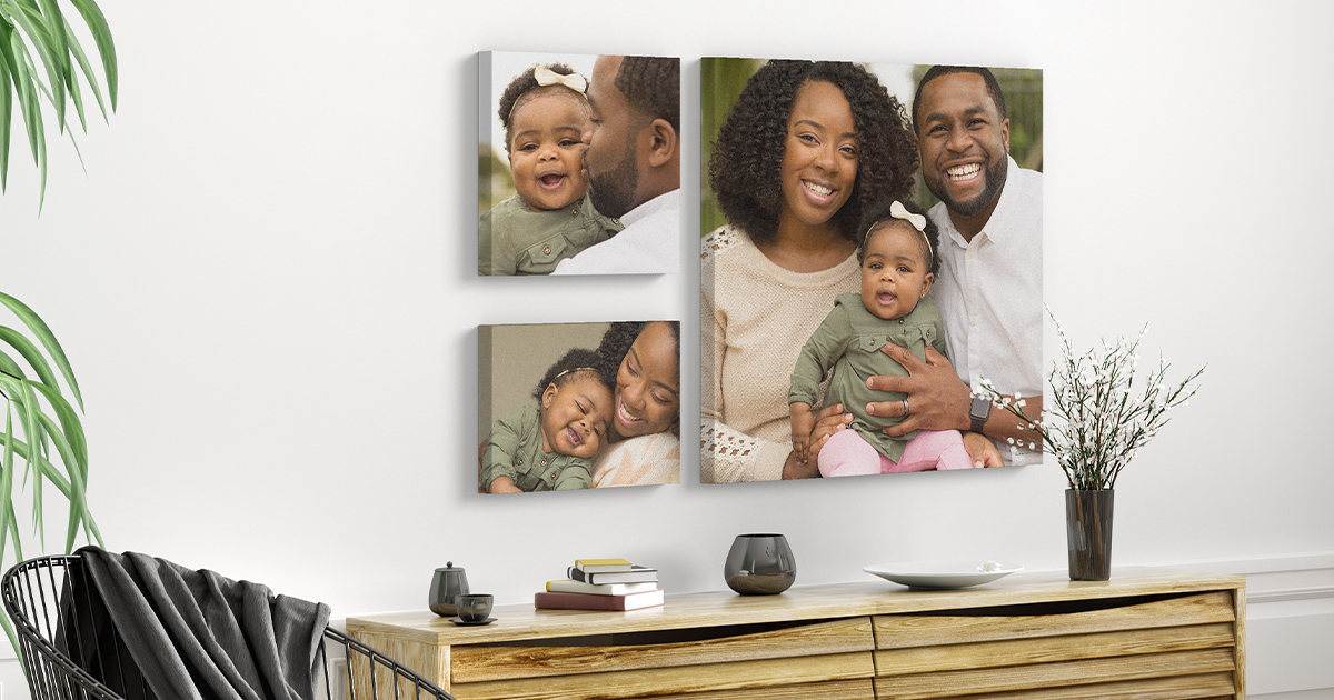 Photo art on the wall of an african american family for an article on print ideas for family memories.