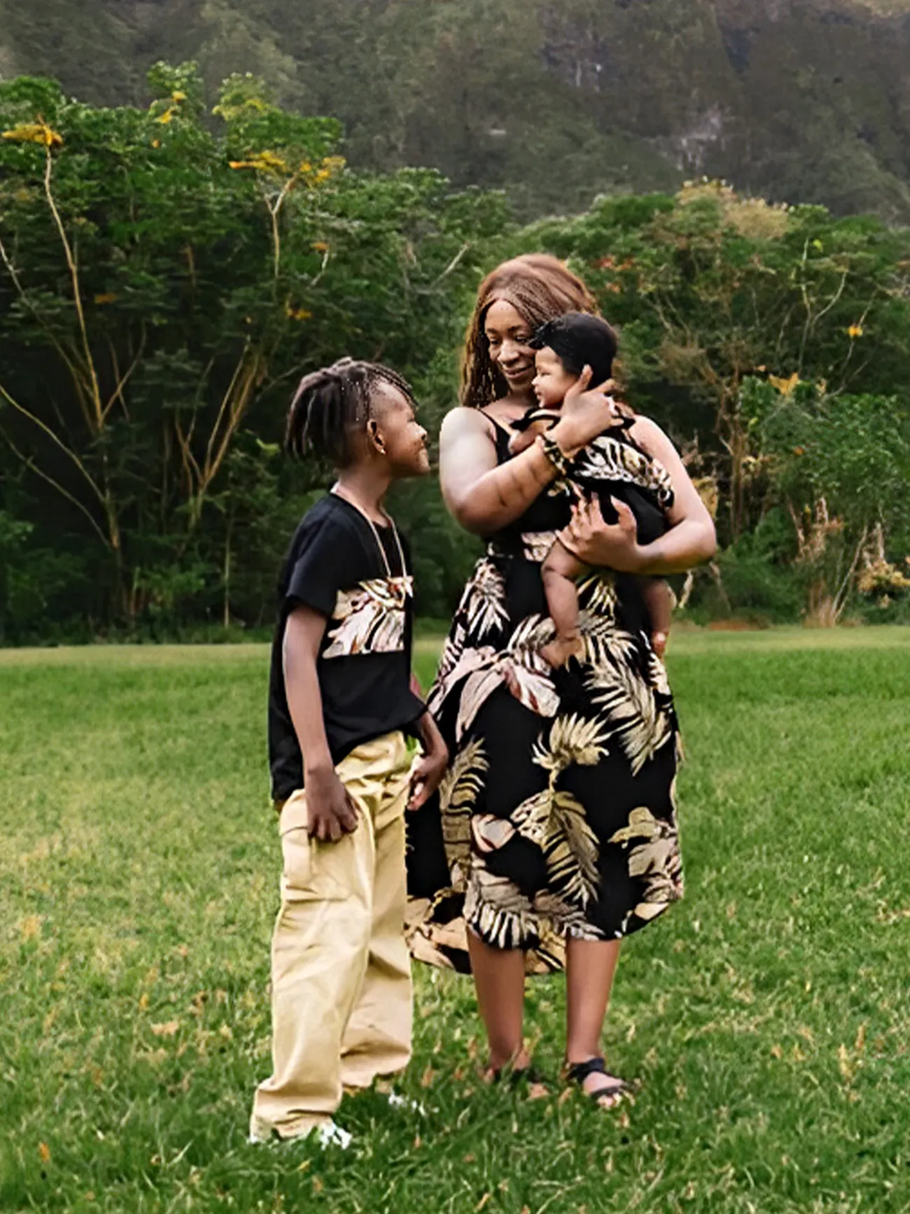 African american mother and children in matching outfits to organize like a pro.