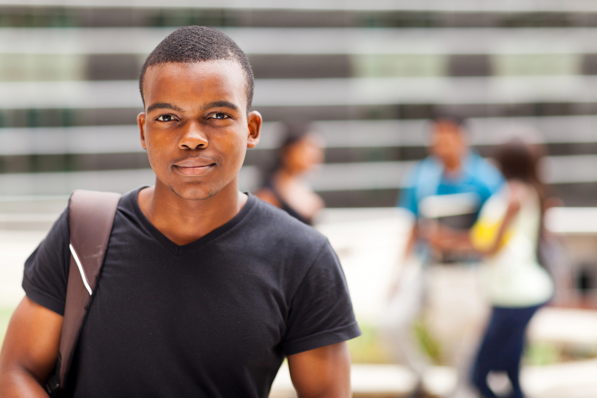 African american boy teen in transition from high school to college