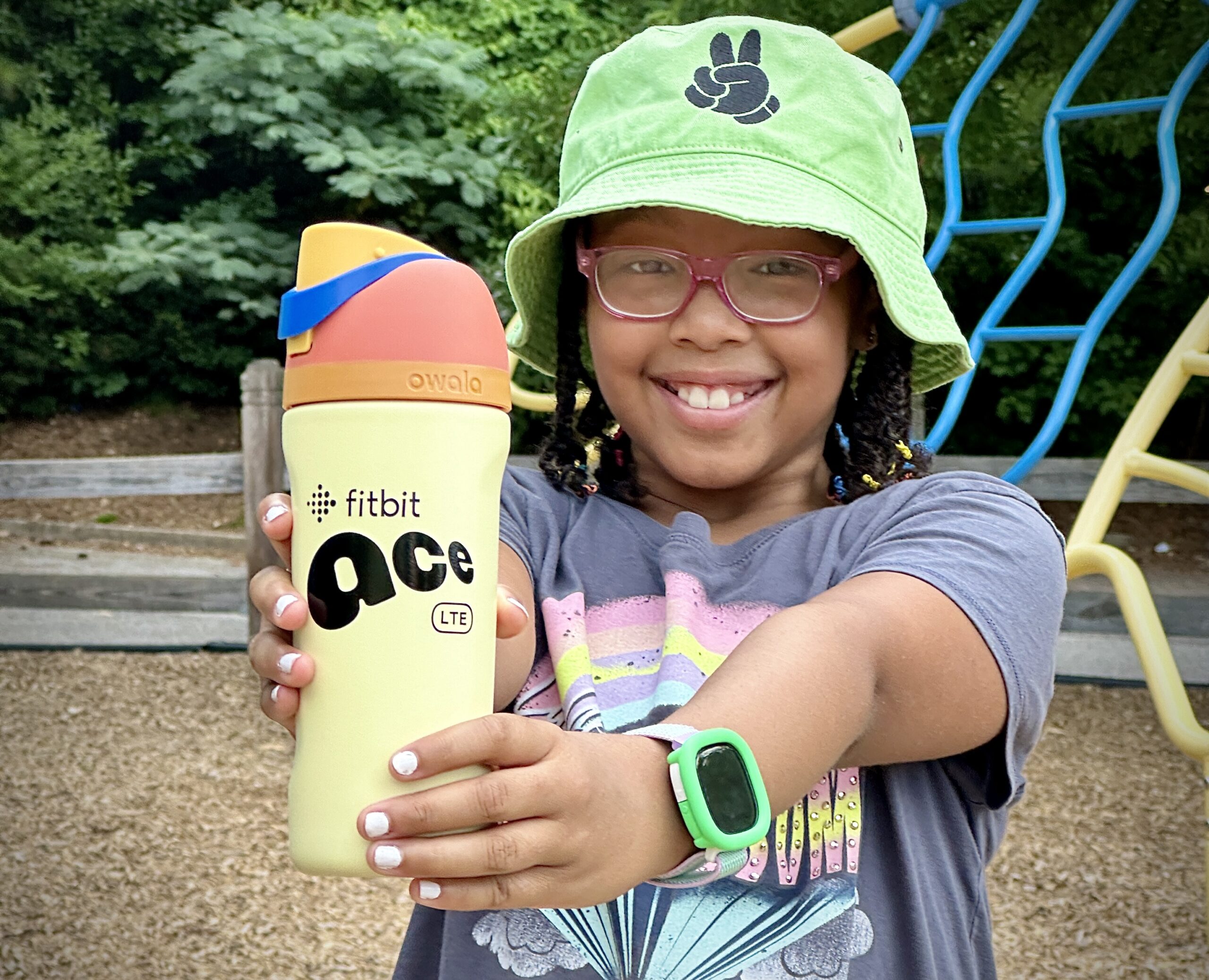 Marley with her google fitbit ace lte for kids and gear.