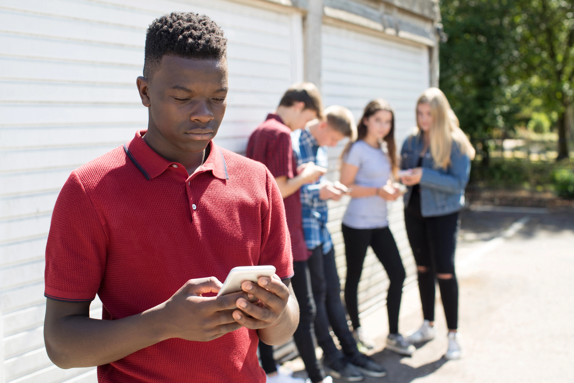The only black male student outside and being teased is many african american students' reality.