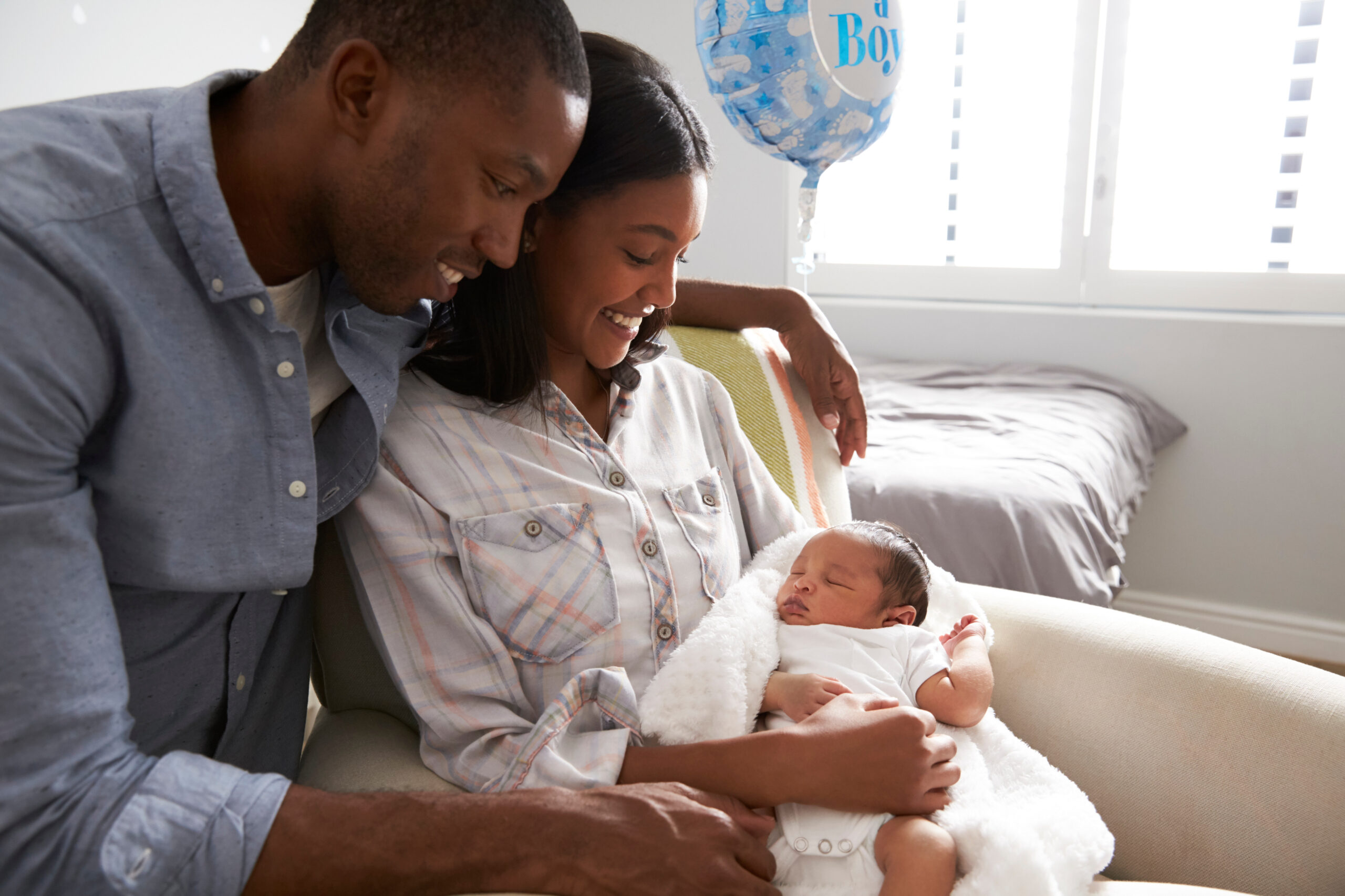 Expert circumcision services for babies: safe and professional circumcision An african american couple with their newborn baby for an article on expert circumcision services for babies: safe and professional circumcision