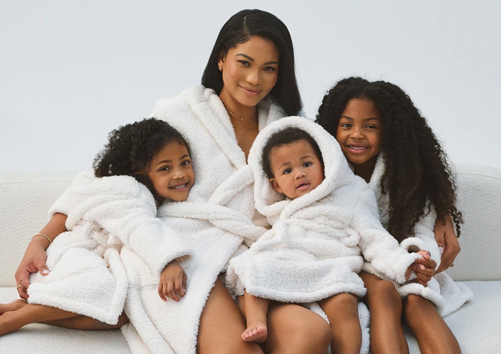 Chanel iman with her children in matching chasa baby lifestyle collection robes, showcasing luxury, softness, and family comfort.