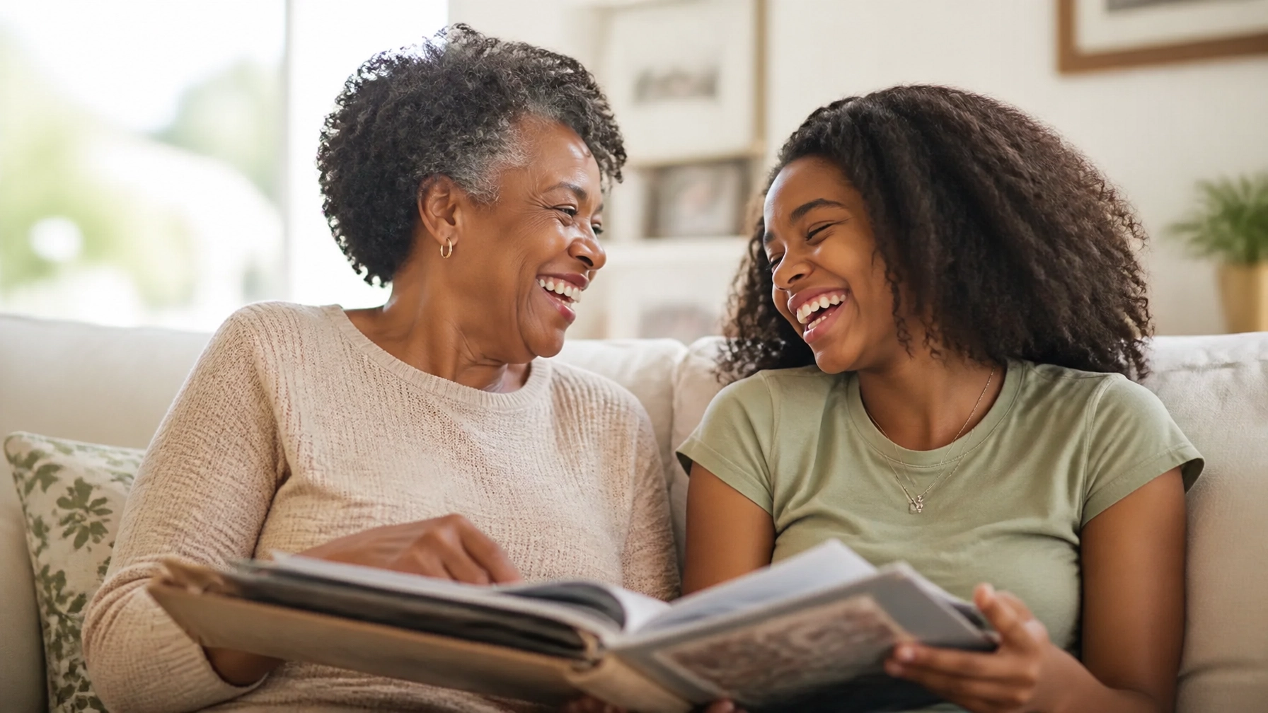 Black grandmother and granddaughter sharing a joyful moment while discussing family values during the grandparents discipline debate.