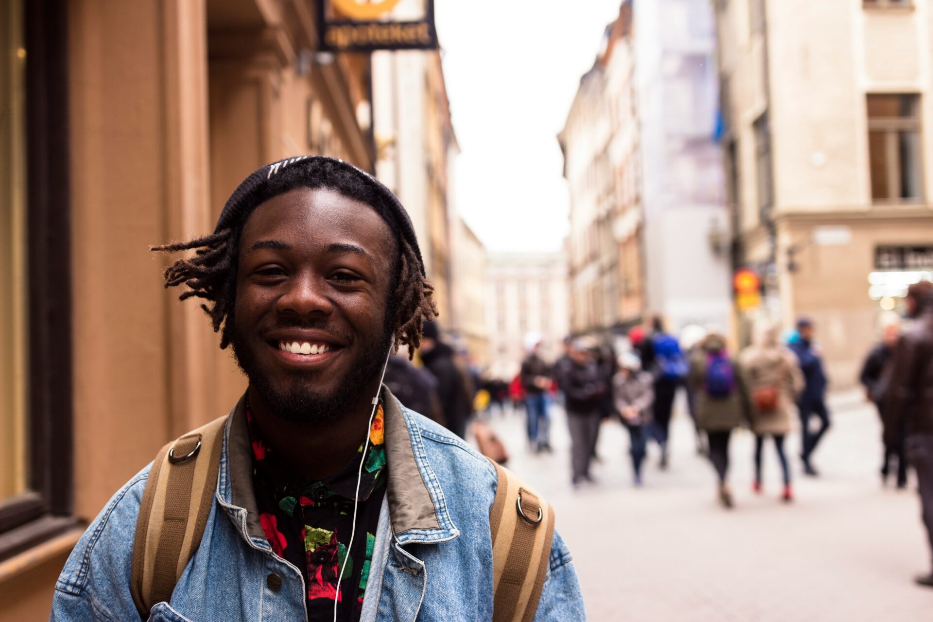 Student budgeting helps reduce student stress as a black college student confidently walks to campus after creating a college budget and managing expenses.